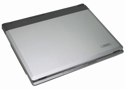 Asus A6Km-Q002H laptop closed, showcasing its silver finish and Asus logo on the lid.