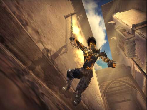 A screenshot from the video game Prince of Persia: The Two Thrones showing the protagonist performing an acrobatic move with a chain in a sunlit, ancient city alley.