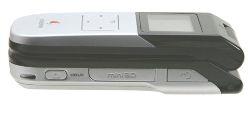 Side view of the Toshiba TS803 - 3G Music Phone showing the volume control buttons, miniSD card slot, and hold switch.