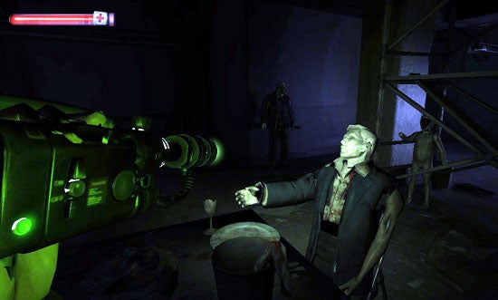 In-game screenshot from Condemned: Criminal Origins showing a first-person view where the player is holding a gun with a green light, aiming at an enemy character in a decaying urban environment. Two additional enemy figures are seen in the background.