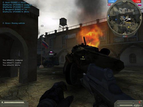 Screenshot from the video game Battlefield 2: Special Forces showing a first-person view of a player holding a gun, with a friendly armored vehicle on the right, an explosion ahead, and a mini-map in the top right corner indicating enemy proximity. Fallen character models are visible on the ground, and a text overlay shows the player has eliminated multiple enemy combatants.
