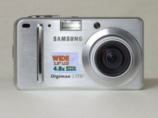 Samsung Digimax L55W camera with wide-angle lens displayed.