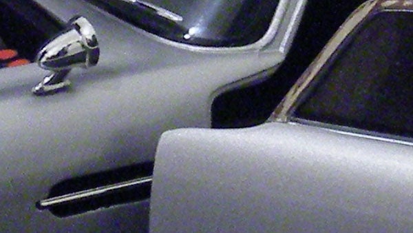 Close-up of a vintage car interior with chrome accents.