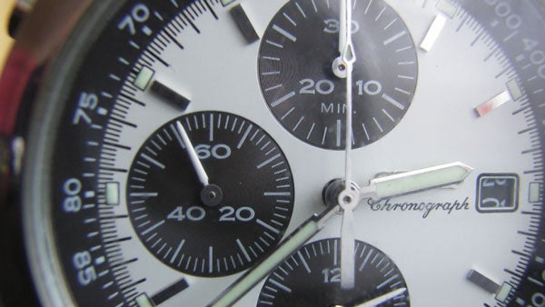 Close-up of a chronograph watch face.
