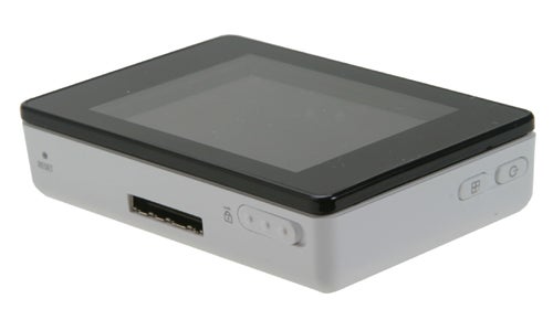 iRiver U10 digital media player on a white background, with the screen facing forwards. The device has a silver frame, a black top panel, and visible control buttons on the front.