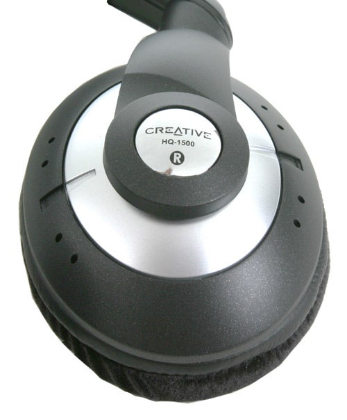 Close-up of the right earcup of a Creative HQ-1500 headphone showing the brand logo and model number with a comfortable cushioned earpad.