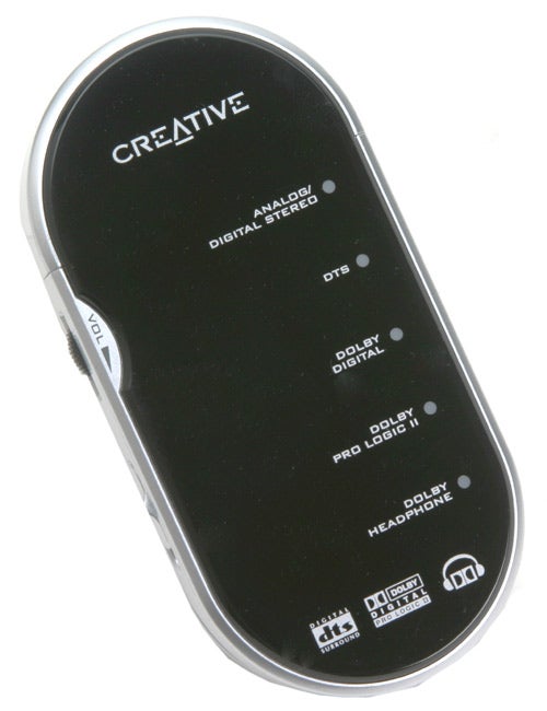 Black Creative HQ-2300D headphone decoder with labeled input buttons for analog/digital stereo, DTS, Dolby Digital, Dolby Pro Logic II, and Dolby Headphone technologies, volume dial on the side, and Creative logo at the top.