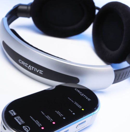 Creative HQ-2300D Dolby headphones with external decoder positioned beside the headphone unit, showcasing the brand logo and design details.
