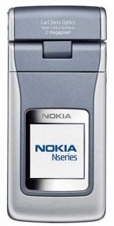 Nokia N90 3G mobile phone in closed position with Carl Zeiss optics label, showcasing the external LCD screen and Nseries logo.