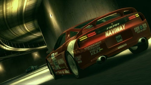 Screenshot of Ridge Racer 6 gameplay featuring a red sports car racing inside a tunnel with another car in the distance.