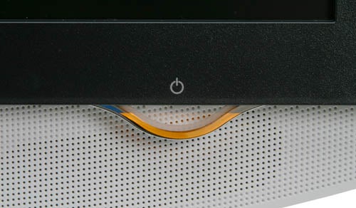 Close-up of the LG Flatron M1910A LCD TV/Monitor showing the power button and part of the speaker grille.