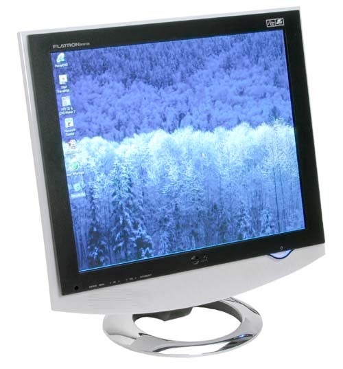 LG Flatron M1910A LCD TV/Monitor on a stand displaying a forest wallpaper on screen.