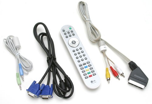 LG Flatron M1910A LCD TV/Monitor accessories laid out on a white background, including a power cable, VGA cable, audio cables, component cables, a remote control, and a SCART adapter.