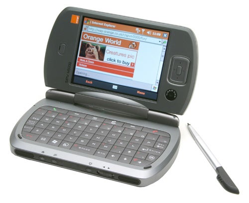 Orange SPV M5000 smartphone with slide-out QWERTY keyboard, stylus, and screen displaying Internet Explorer on Orange World homepage.