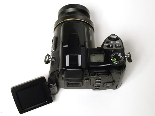 Nikon CoolPix 8800 camera displayed on a white background with its swivel LCD screen open and lens extended.