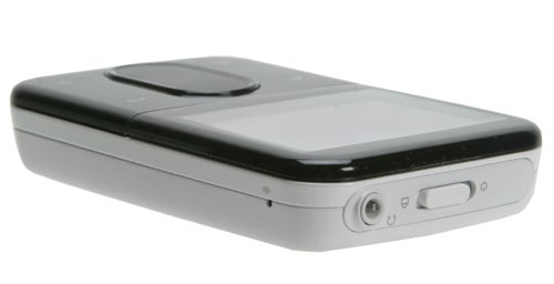 Creative Zen Vision: M portable media player in black and white color scheme, showing the front display and control pad, side volume controls, and headphone jack.