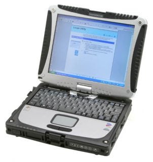 Panasonic ToughBook CF-18 rugged laptop with screen showing desktop and application, full keyboard, touchpad and stylized rugged case design.