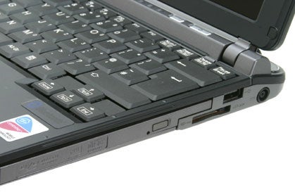 Close-up view of the keyboard and side port selection on the Fujitsu-Siemens Lifebook P7120 laptop.