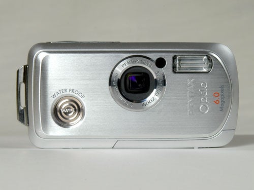 A Pentax Optio WPi waterproof digital camera with a 6.0-megapixel label, silver body, and lens visible at the center.