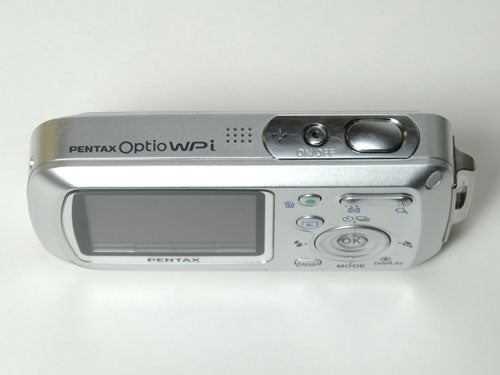 Pentax Optio WPi waterproof camera on a white background, showcasing its front face with silver casing, LCD screen, control buttons, and branding.