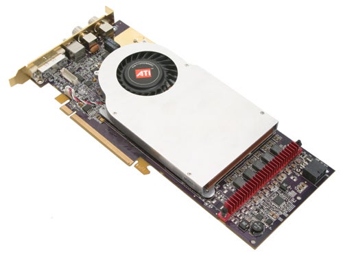 ATI All-in-Wonder X1900 graphics card with white cooler fan and red circuitry on a beige background.