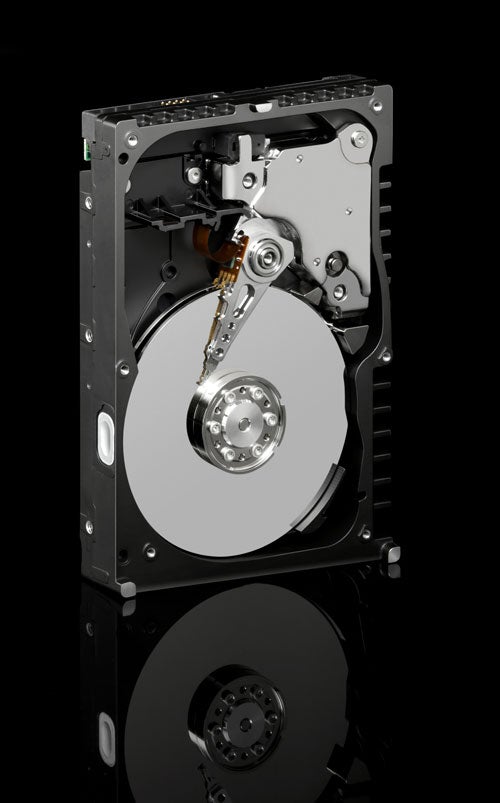 Western Digital WD1500ADFD Raptor Hard Disk with open casing showing the internal disk and read-write armature on a reflective black surface.
