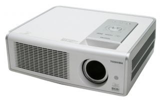 Toshiba TDP-MT700 HD Projector with a white casing, featuring a prominent lens on the left, control buttons on top, and a vented side panel.