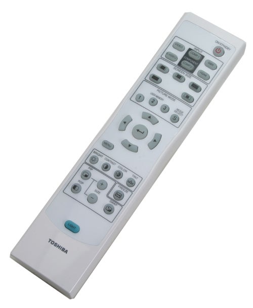 White Toshiba remote control with multiple buttons including power, menu navigation, and input selection, labeled with the Toshiba brand at the bottom.