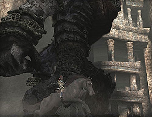 Screenshot from the video game Shadow of the Colossus showing the main character on horseback confronting a massive stone Colossus near ancient ruins.