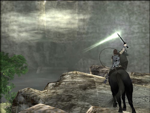 Screenshot from the video game Shadow of the Colossus showing the main character, Wander, riding a horse and holding up a sword that is reflecting light, indicating the direction of the next Colossus in a misty landscape.