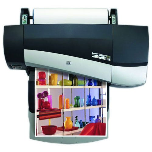 HP DesignJet 90r large format printer with a sample printout featuring colorful glassware and pottery images demonstrating print quality.