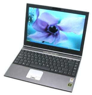 Sony VAIO VGN-SZ1VP laptop with a widescreen display featuring a flower wallpaper, a black keyboard, and a silver chassis.
