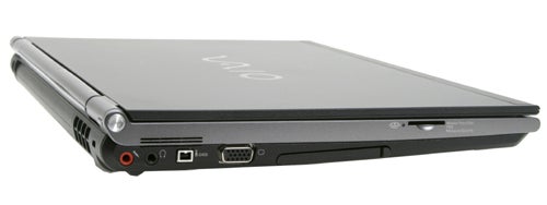 A Sony VAIO VGN-SZ1VP laptop in closed position with a focus on the left-side ports, including audio input/output, USB, and VGA connectors. The VAIO logo is visible on the laptop's cover.