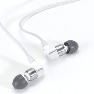 Shure e4c Sound Isolating Earphones with white cables and detachable ear tips on a white background.