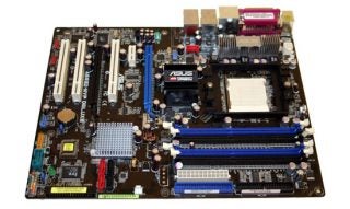 ASUS A8R32-MVP Deluxe motherboard showing CPU socket, RAM slots, and expansion card slots on a brown PCB with clearly labeled branding.