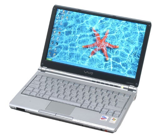 Sony VAIO VGN-TX2XP laptop open on a desk showing its keyboard, screen with a wallpaper of a red starfish in blue water, and the VAIO logo visible on the lower bezel.