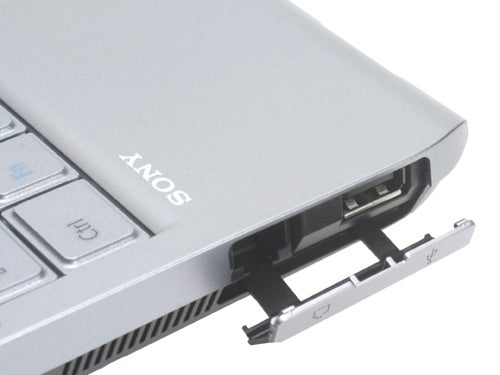 Close-up of a silver Sony VAIO VGN-TX2XP laptop focusing on the connectivity ports on the side.