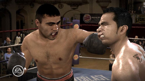 Screenshot from the video game Fight Night Round 3 showing an in-game boxing match with one boxer delivering a punch to the face of his opponent.