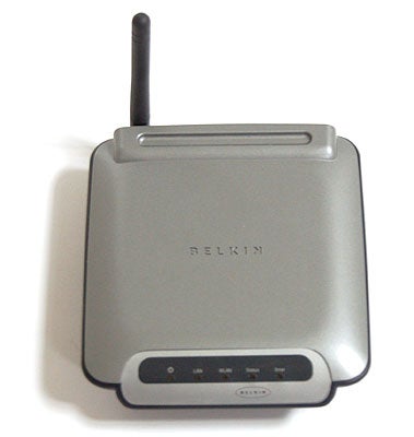 Belkin Wireless G Print Server with antenna and status indicator lights visible on the front panel.