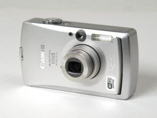 Silver Canon IXUS Wireless compact digital camera on a white background.