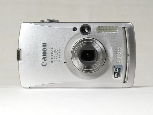 Canon IXUS Wireless digital camera with 5.0 Megapixels and 3x optical zoom displayed against a neutral background.
