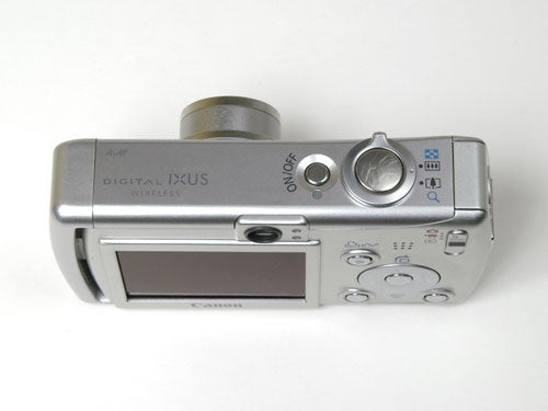 Canon IXUS Wireless digital camera displayed on a white background showing the rear LCD screen and control buttons.