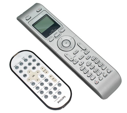 Two Philips remote controls for the WACS700/05 Wireless Music Station, with a display screen and buttons on the larger remote.