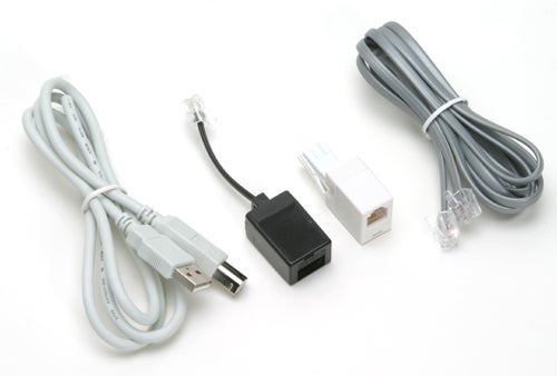 Actiontec VoSKY Call Center USB device with accompanying RJ11 phone cable and a USB extension cable on a white background.