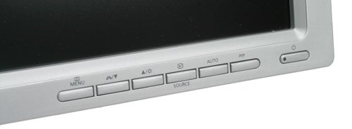 Close-up view of the Samsung SyncMaster 244T monitor's control panel with power and menu buttons