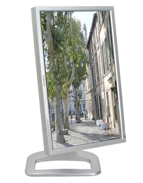 Samsung SyncMaster 244T monitor displaying a street view image with clear details and color accuracy.