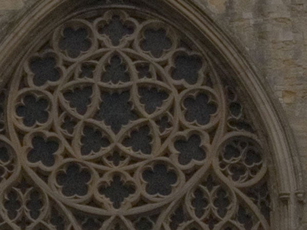 Close-up of intricate stone filigree work on a gothic cathedral window demonstrating the Olympus E-500 digital SLR camera's detail capturing ability.