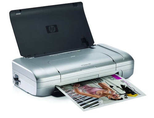 HP DeskJet 460wbt mobile inkjet printer printing a color document with a female model on it.