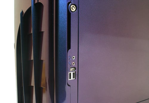 Close-up view of the blue and black Wired2Fire Pyro 64-FX desktop PC's side panel, showcasing the USB and audio ports.