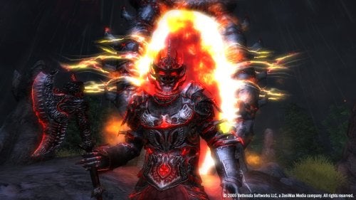 A character in red and black armor with glowing orange eyes stands with an aggressive stance in a dark, ominous environment. Behind the character, a fiery magical effect resembles an explosion. This is a screenshot from the video game The Elder Scrolls IV: Oblivion.